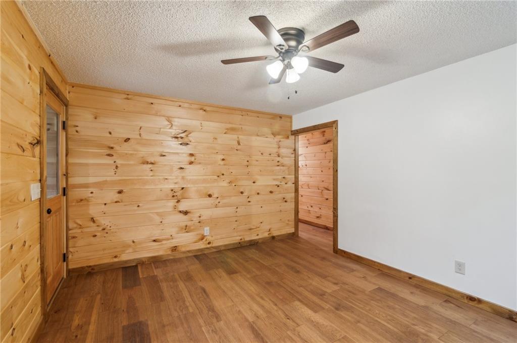 519 Barnes Drive Ellijay, GA 30540 - Photo 4 of 15 a view of empty room with wooden floor and fan