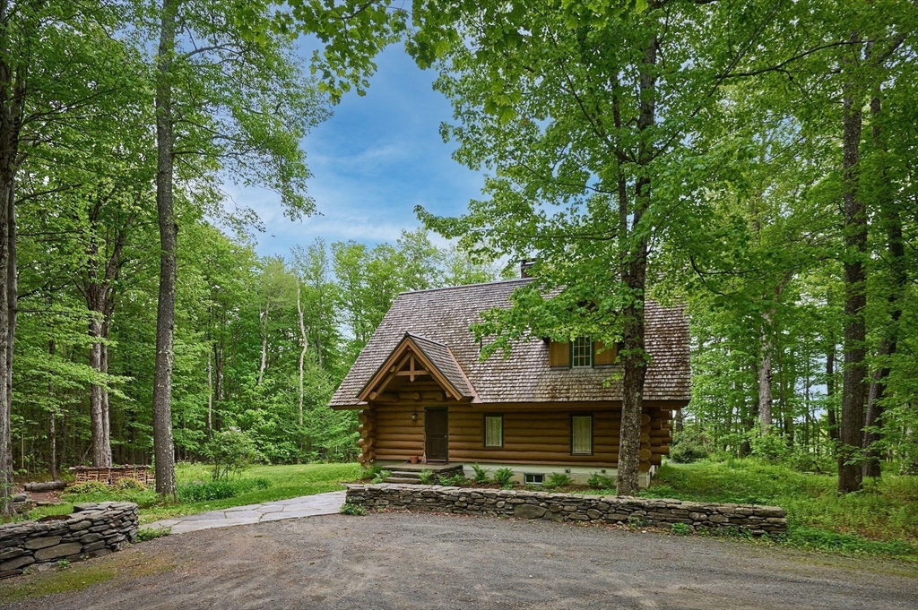 486 Old Stage Road Ashfield, MA 01330 - Photo 31 of 36 a view of a house with a yard and large trees