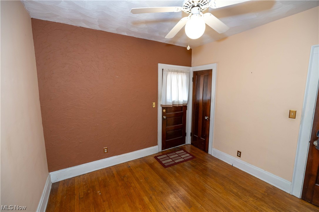 10105 Unity Avenue Cleveland, OH 44111 - Photo 18 of 35 Spare room featuring dark hardwood floors and ceiling fan