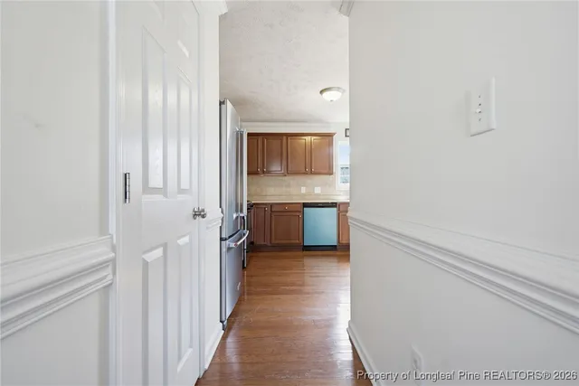 a view of a kitchen from the hallway