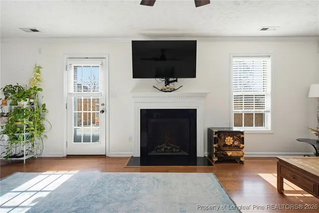 a view of a livingroom with furniture and a fireplace