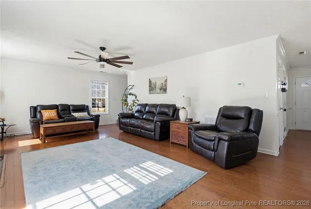 a living room with furniture rug and couch