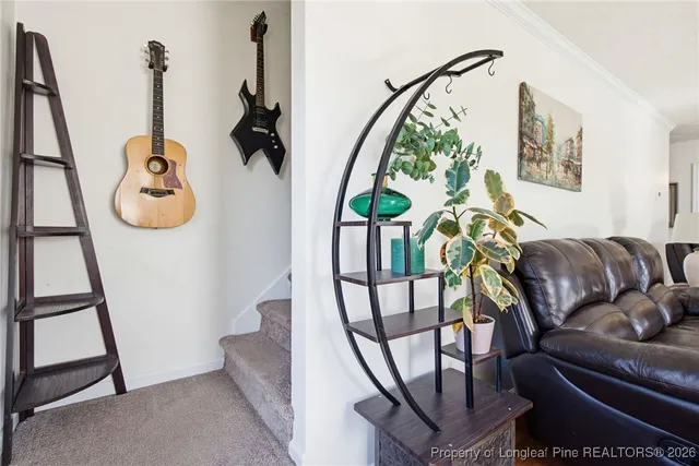 a view of living room with furniture and rug
