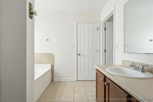 a bathroom with a sink a shower and a mirror