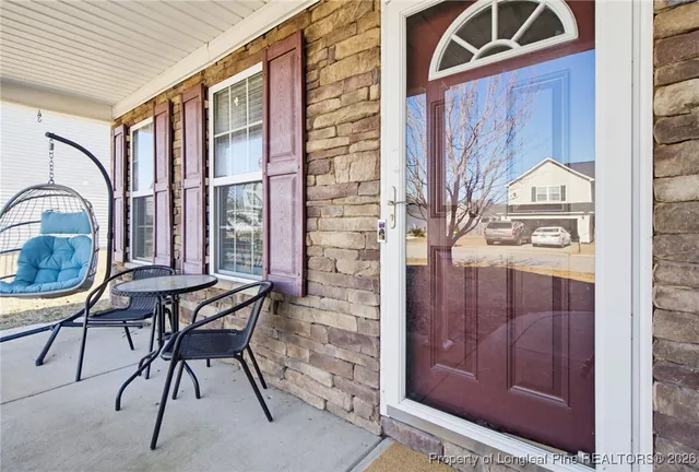 a view of a livingroom with furniture and staircase