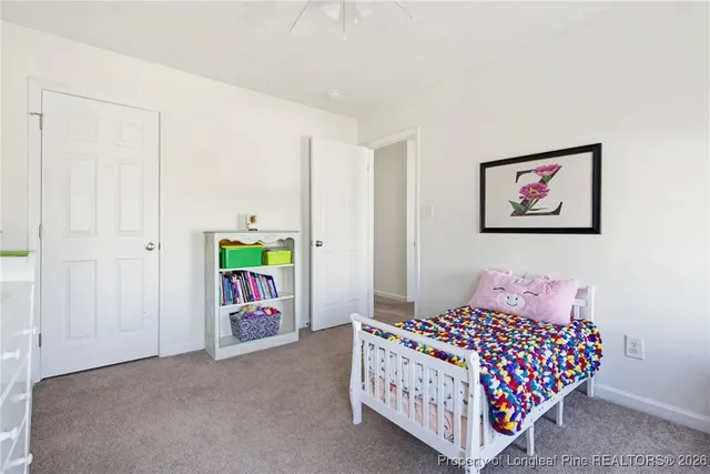 a bedroom with furniture and a baby crib