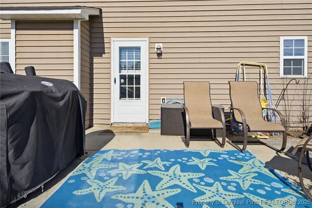 a balcony view with a outdoor seating