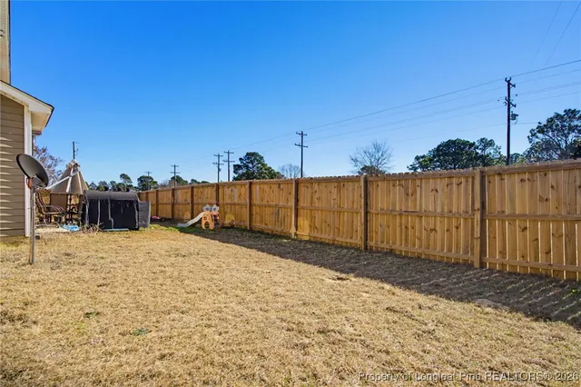 a view of a backyard of the house