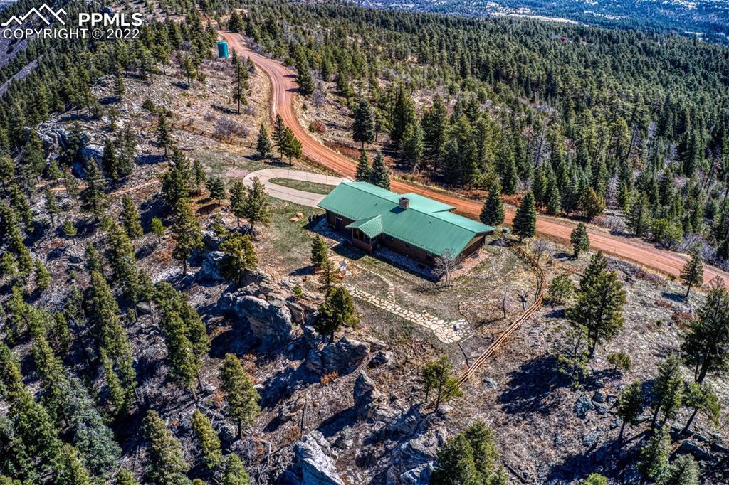 8774 Ridge Road Beulah, CO 81023 - Photo 3 of 46 an aerial view of a house with a yard