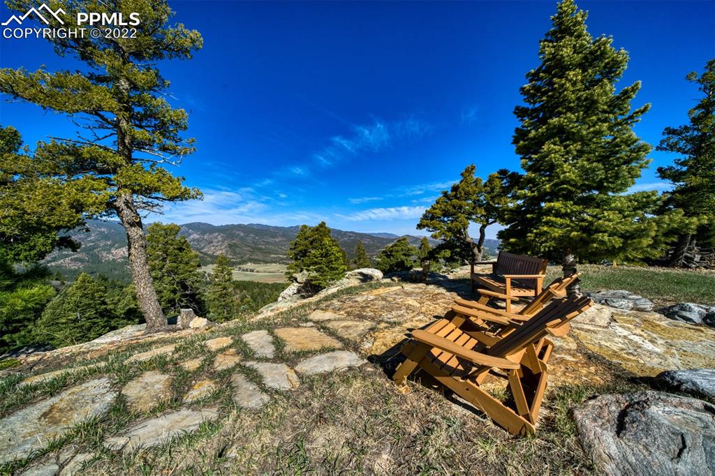 8774 Ridge Road Beulah, CO 81023 - Photo 8 of 46 a view of a terrace with lawn chairs