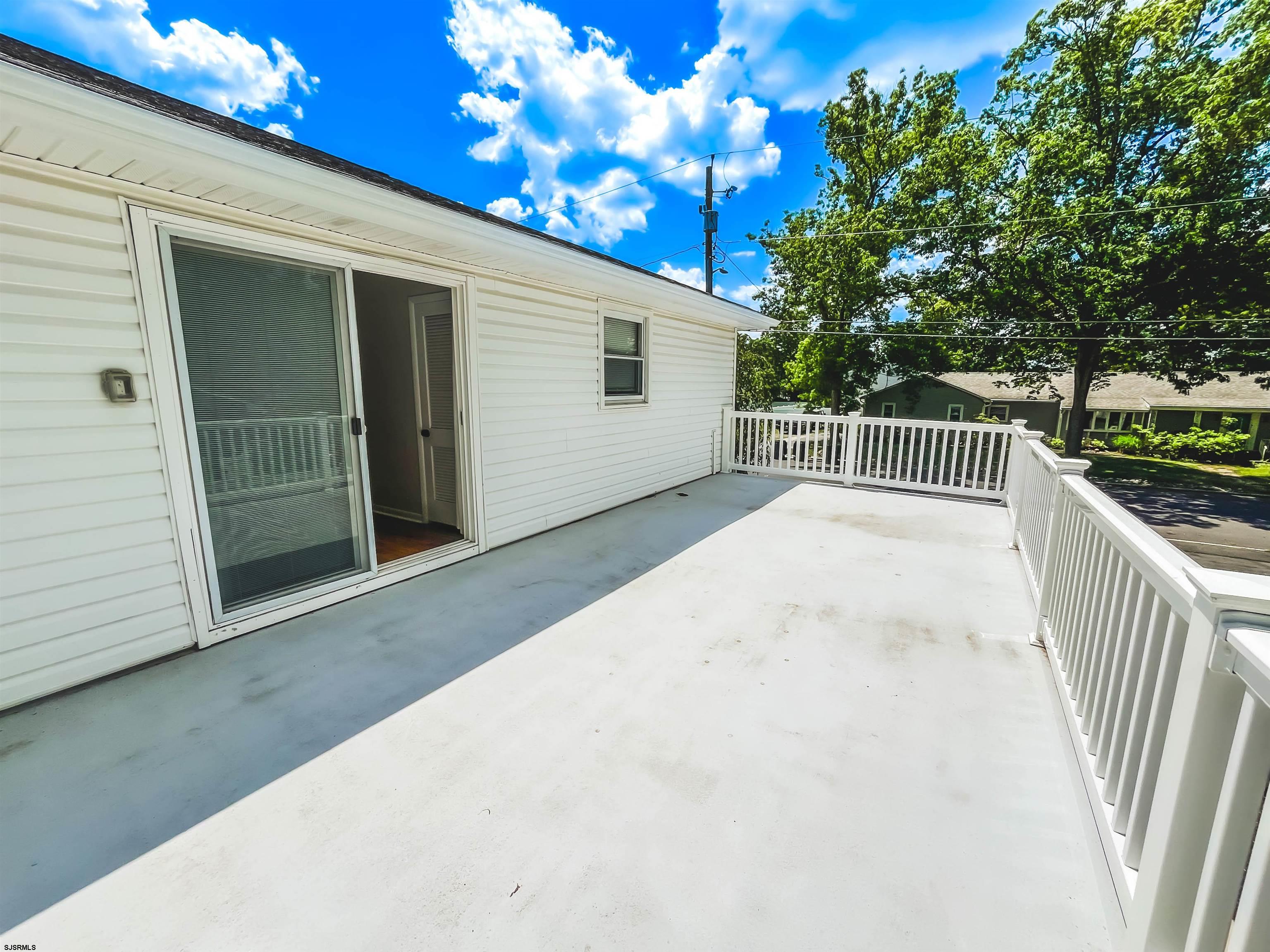 518 Delaware Avenue Absecon, NJ 08201 - Photo 23 of 38 a view of balcony with wooden floor and fence