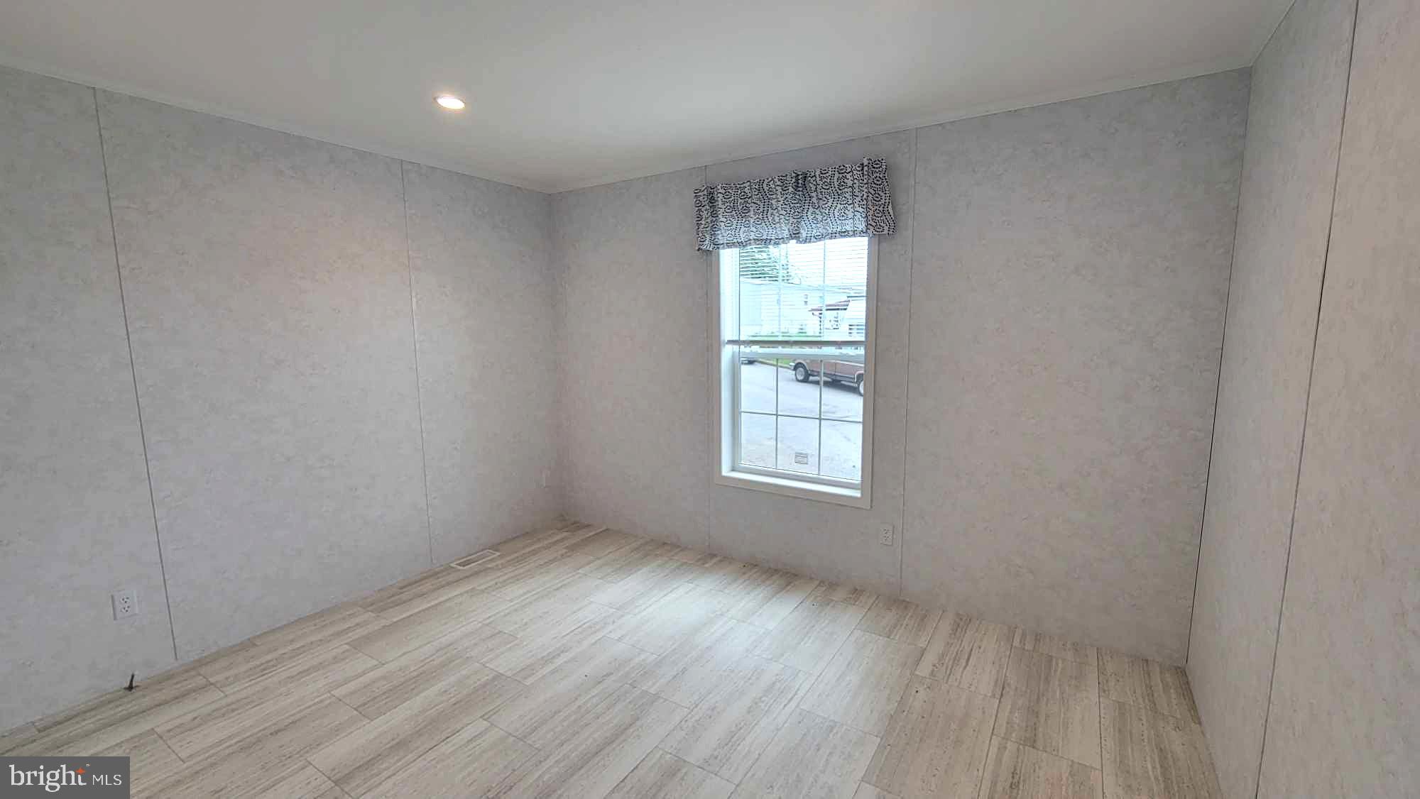 89 Valley View Road Birdsboro, PA 19508 - Photo 15 of 21 an empty room with wooden floor and windows