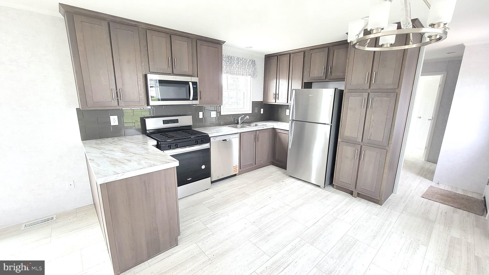 89 Valley View Road Birdsboro, PA 19508 - Photo 5 of 21 a kitchen with a refrigerator sink and microwave