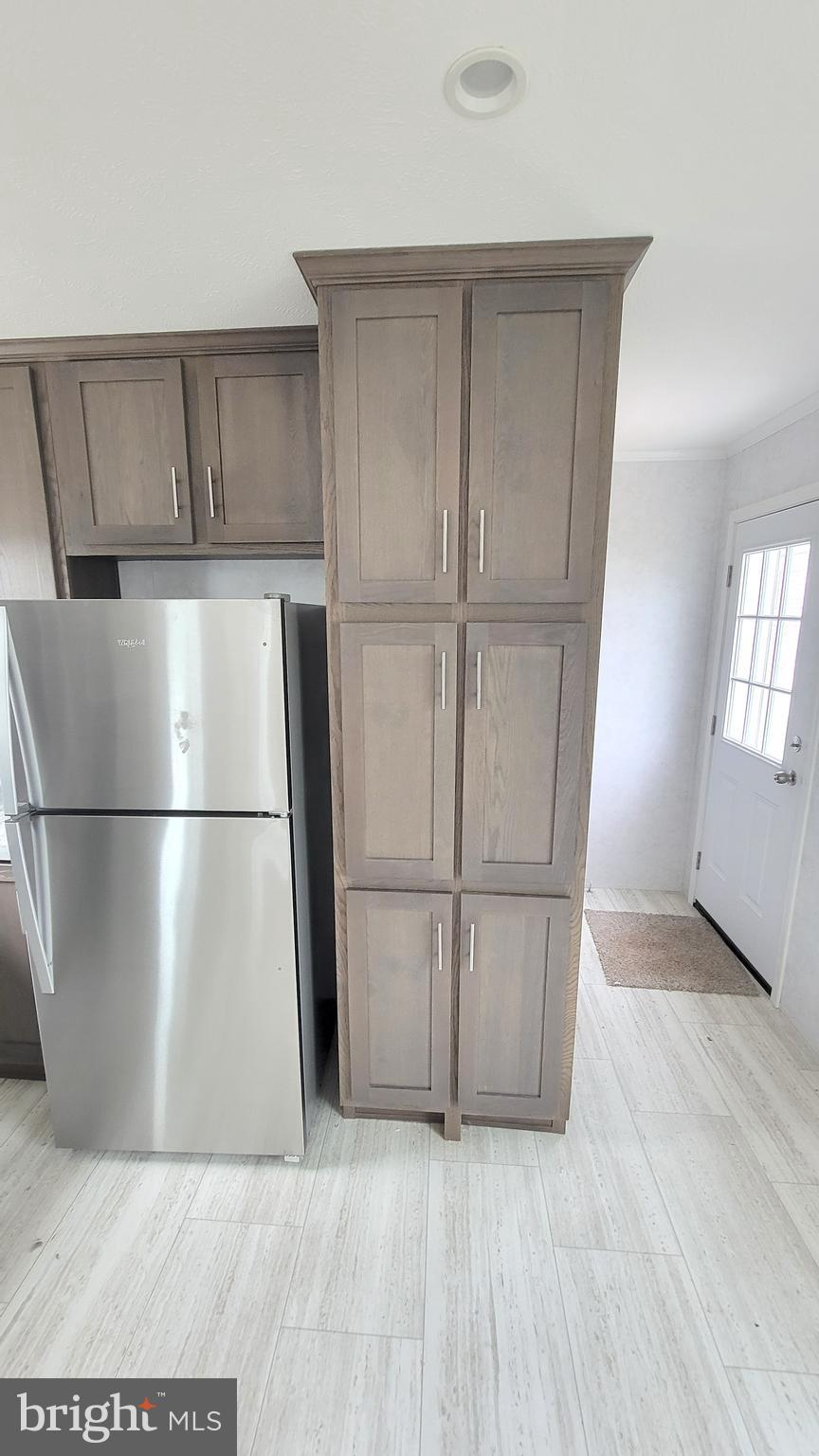 89 Valley View Road Birdsboro, PA 19508 - Photo 9 of 21 a view of a refrigerator in kitchen and wooden floor