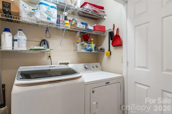 a bedroom with a bed dresser and window