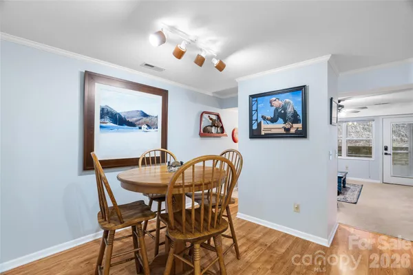 a dining room with furniture and window
