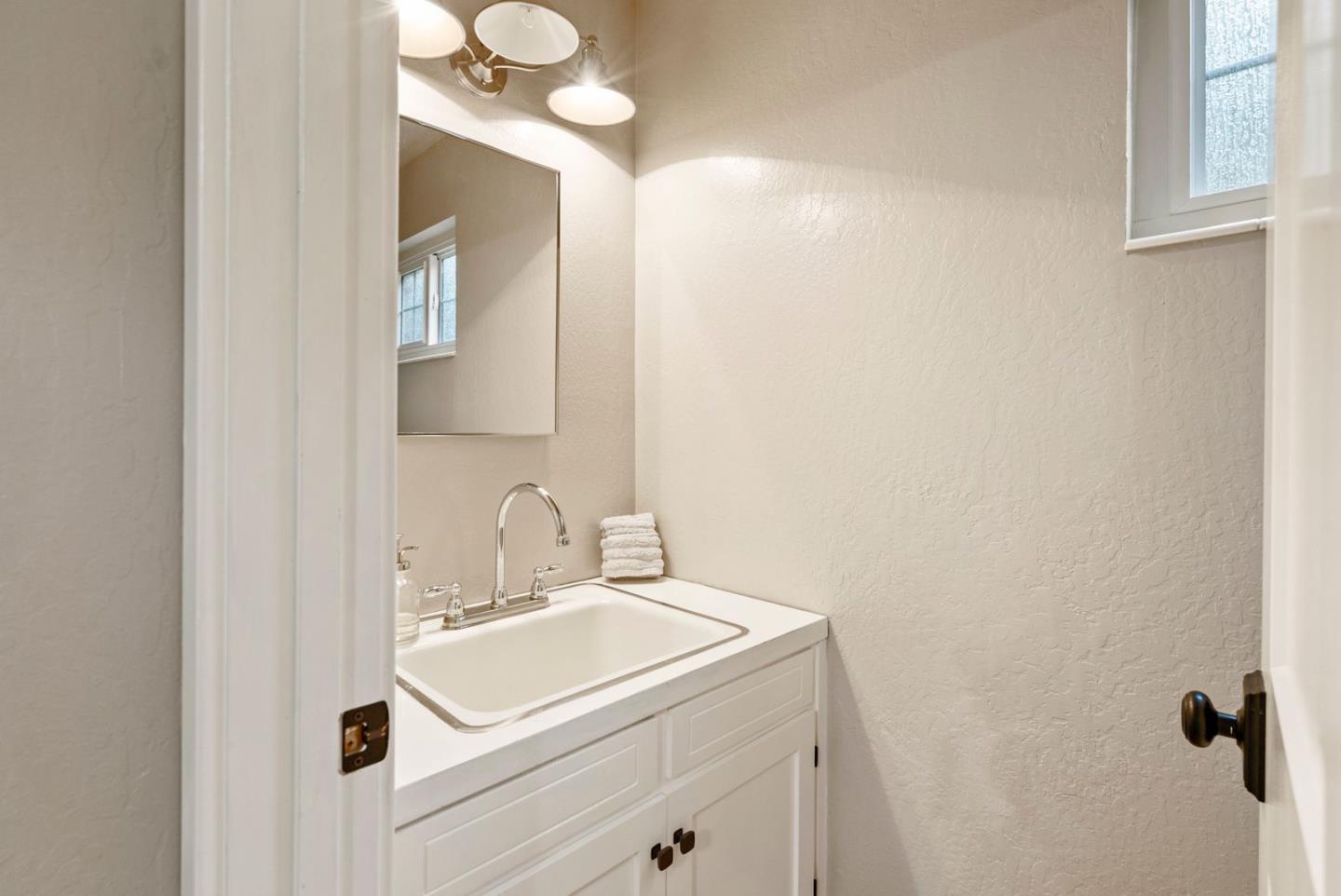 105 Rays Circle Hollister, CA 95023 - Photo 20 of 37 a bathroom with a sink and a mirror
