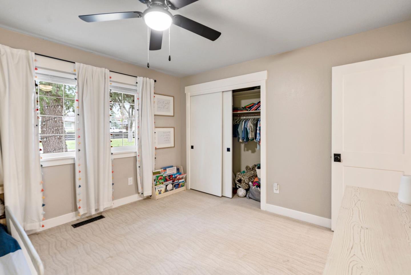 105 Rays Circle Hollister, CA 95023 - Photo 24 of 37 an empty room with ceiling fan and window