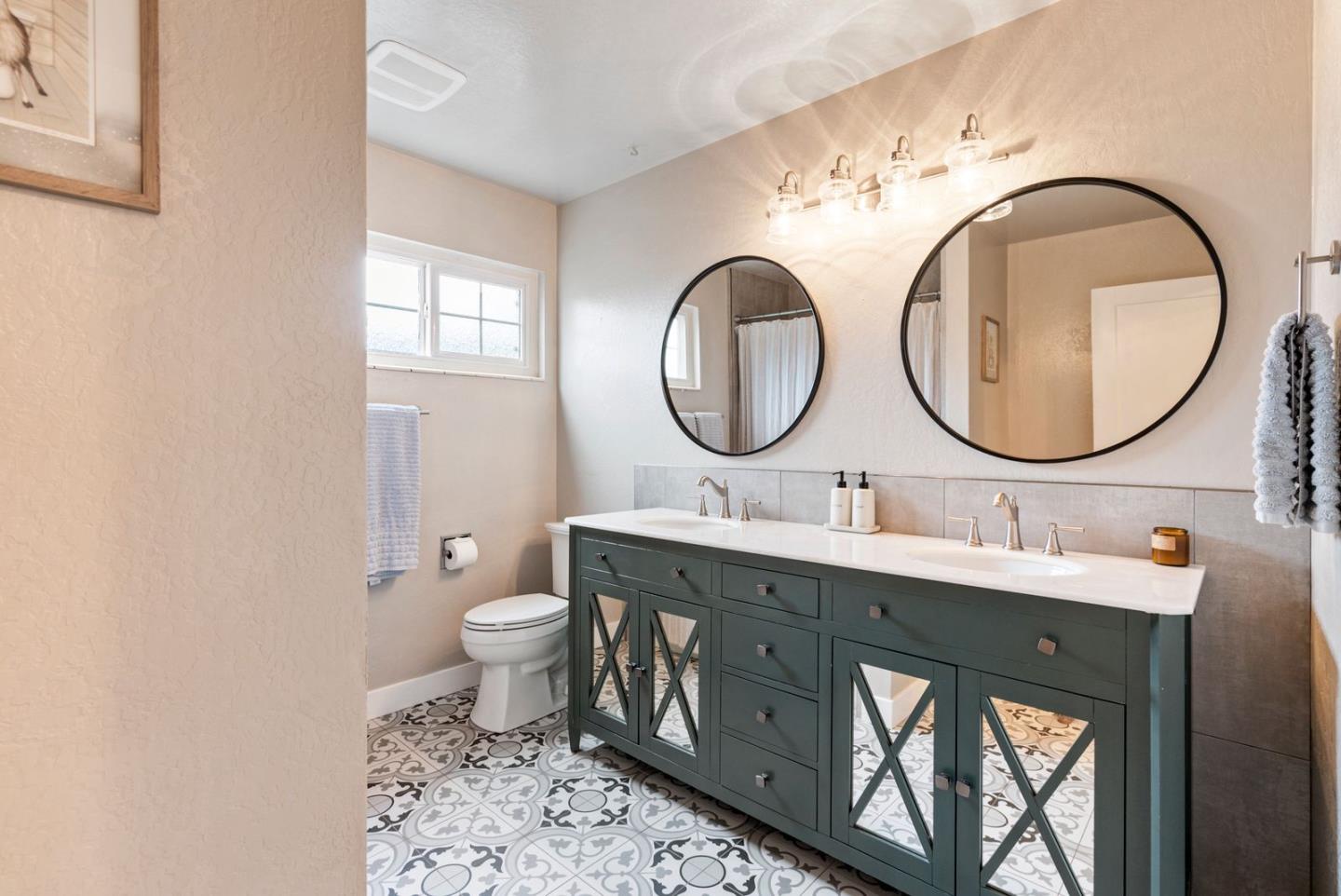 105 Rays Circle Hollister, CA 95023 - Photo 26 of 37 a bathroom with a toilet a sink and a mirror