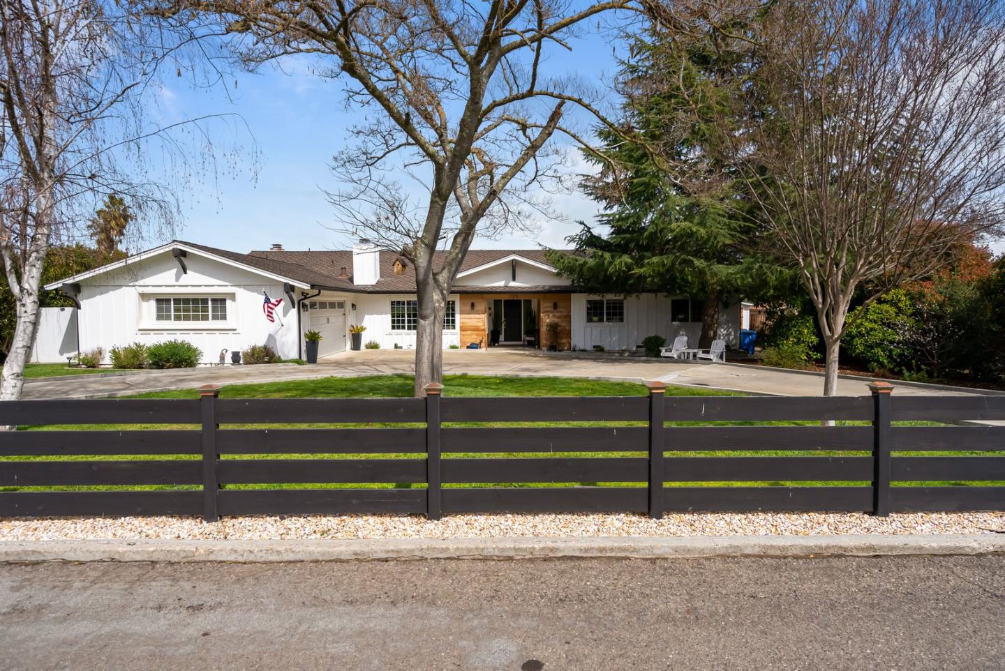 105 Rays Circle Hollister, CA 95023 - Photo 6 of 37 a front view of a house with a garden