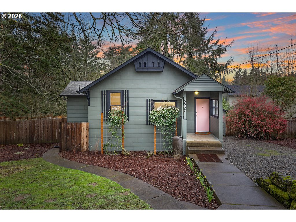 5537 Southwest Florida Street Portland, OR 97219 - Photo 1 of 45 a front view of a house with garden