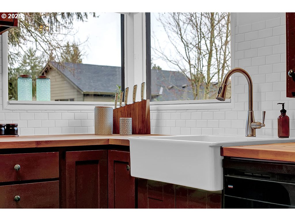 5537 Southwest Florida Street Portland, OR 97219 - Photo 17 of 45 a kitchen with a sink cabinets and a stove