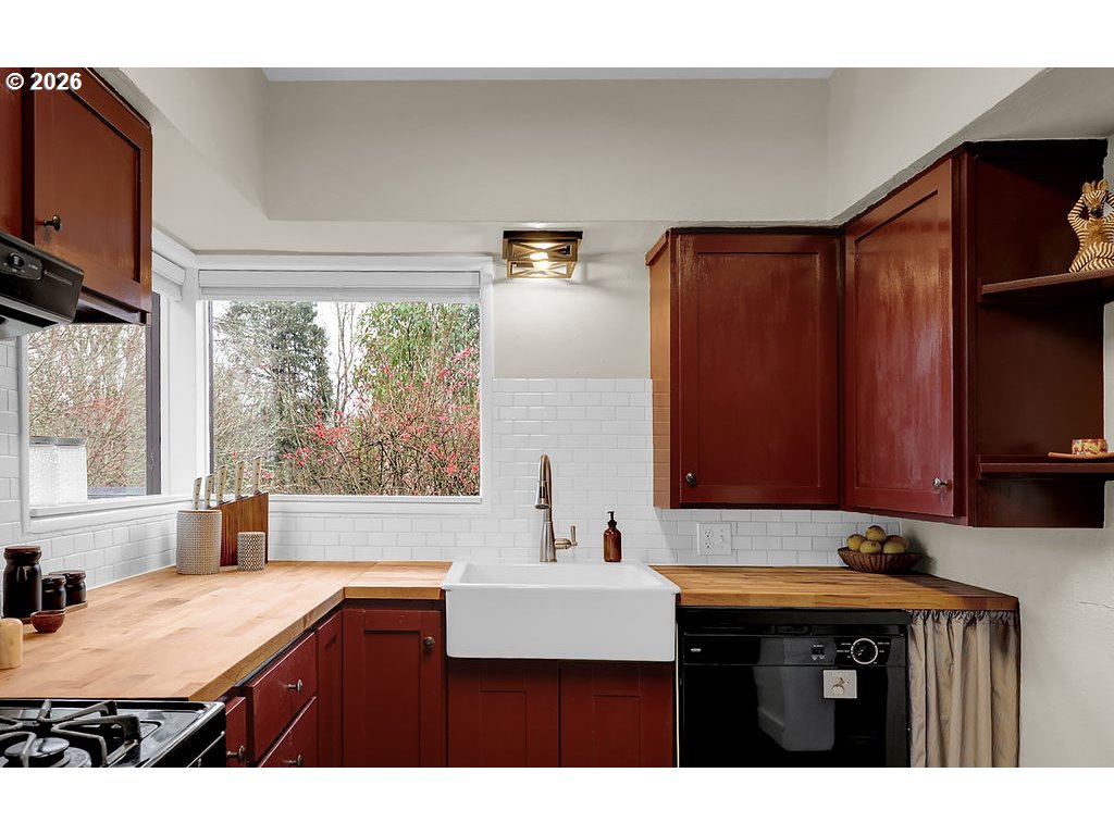 5537 Southwest Florida Street Portland, OR 97219 - Photo 18 of 45 a kitchen with a sink cabinets and window