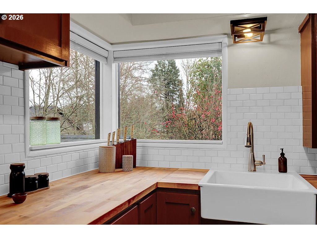 5537 Southwest Florida Street Portland, OR 97219 - Photo 19 of 45 a bathroom with a bathtub and a sink