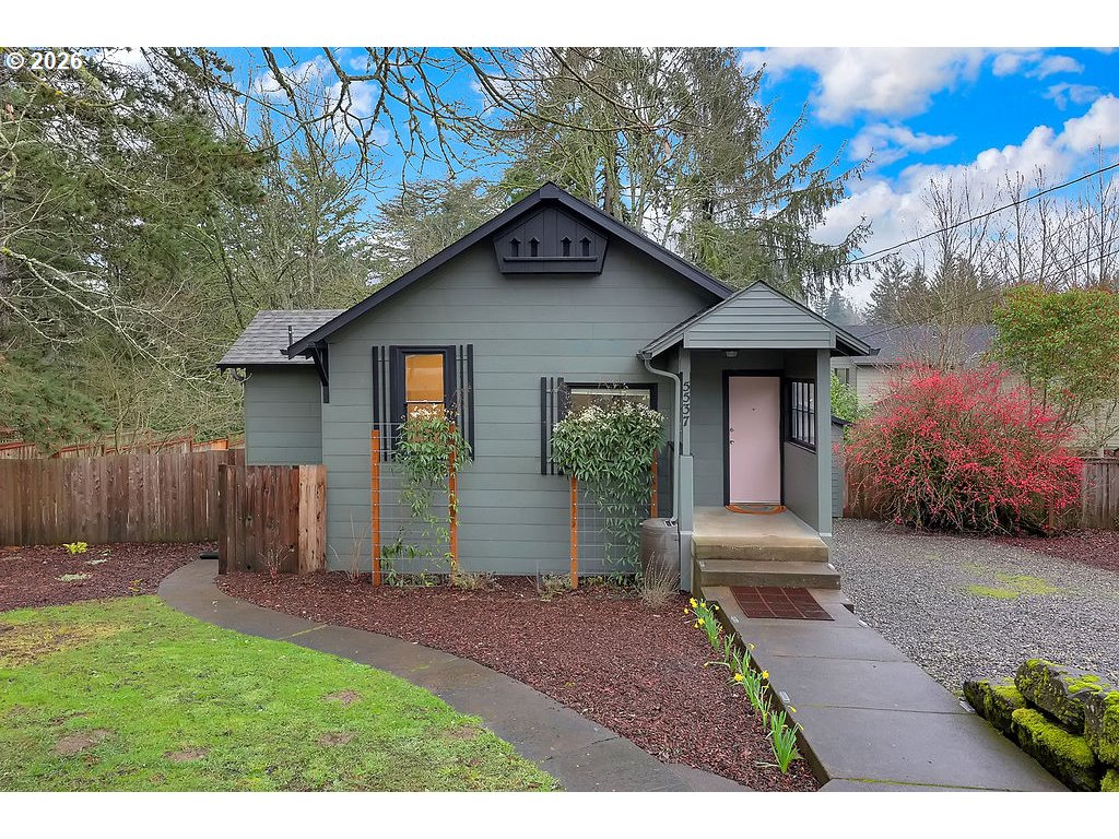 5537 Southwest Florida Street Portland, OR 97219 - Photo 2 of 45 a view of a house with a yard plants and large tree