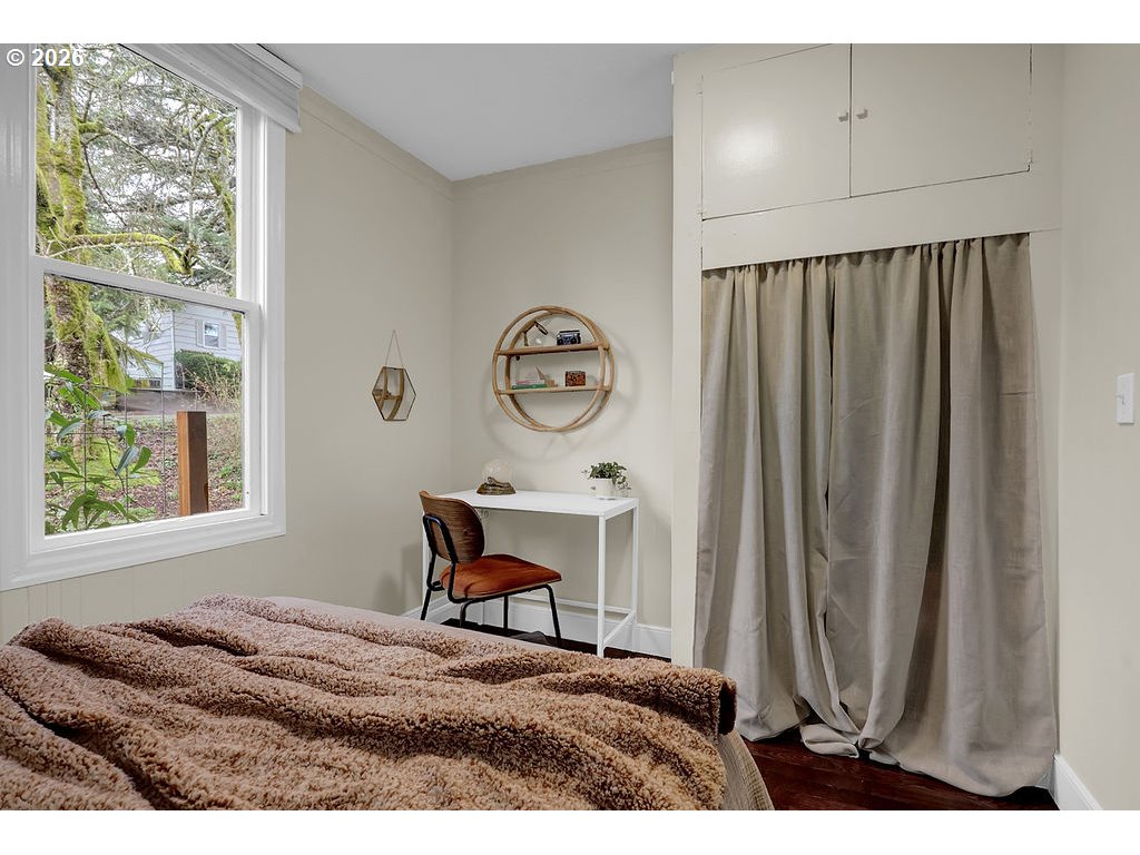 5537 Southwest Florida Street Portland, OR 97219 - Photo 25 of 45 a view of a bedroom with furniture and window