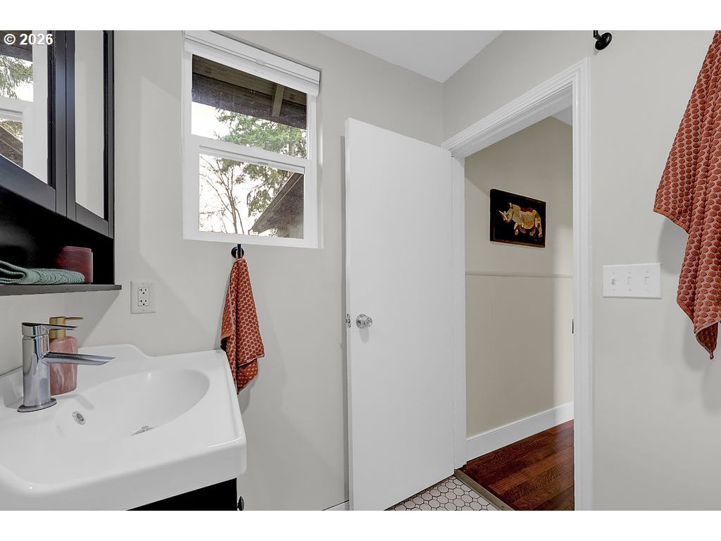 5537 Southwest Florida Street Portland, OR 97219 - Photo 26 of 45 a bathroom with a sink and a mirror