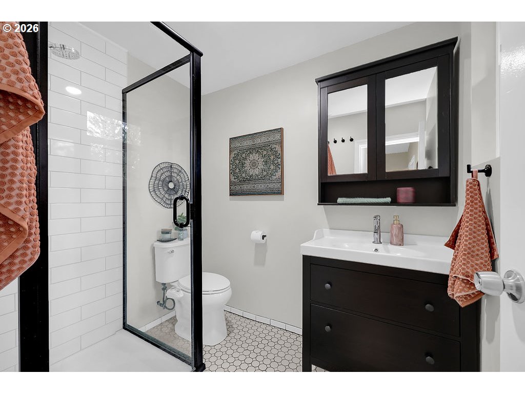 5537 Southwest Florida Street Portland, OR 97219 - Photo 27 of 45 a bathroom with a sink vanity and a mirror