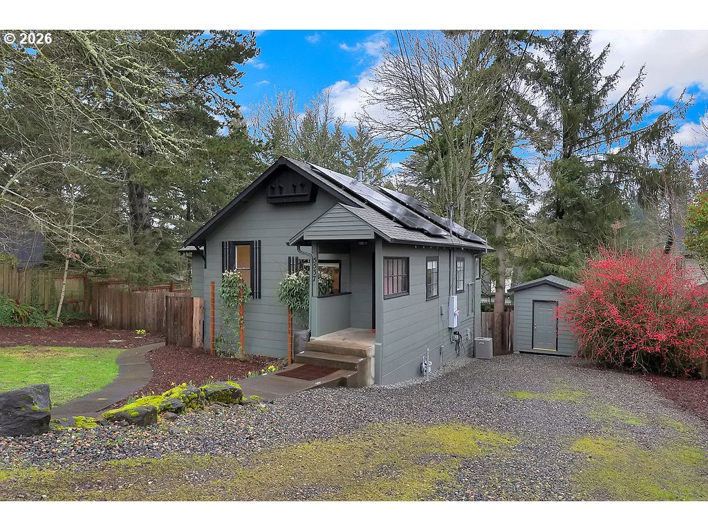 5537 Southwest Florida Street Portland, OR 97219 - Photo 30 of 45 a view of a house with a yard and potted plants