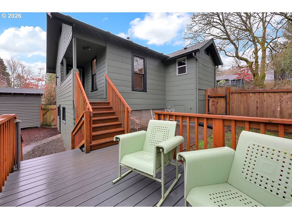 5537 Southwest Florida Street Portland, OR 97219 - Photo 32 of 45 a balcony with wooden floor stairs and furniture
