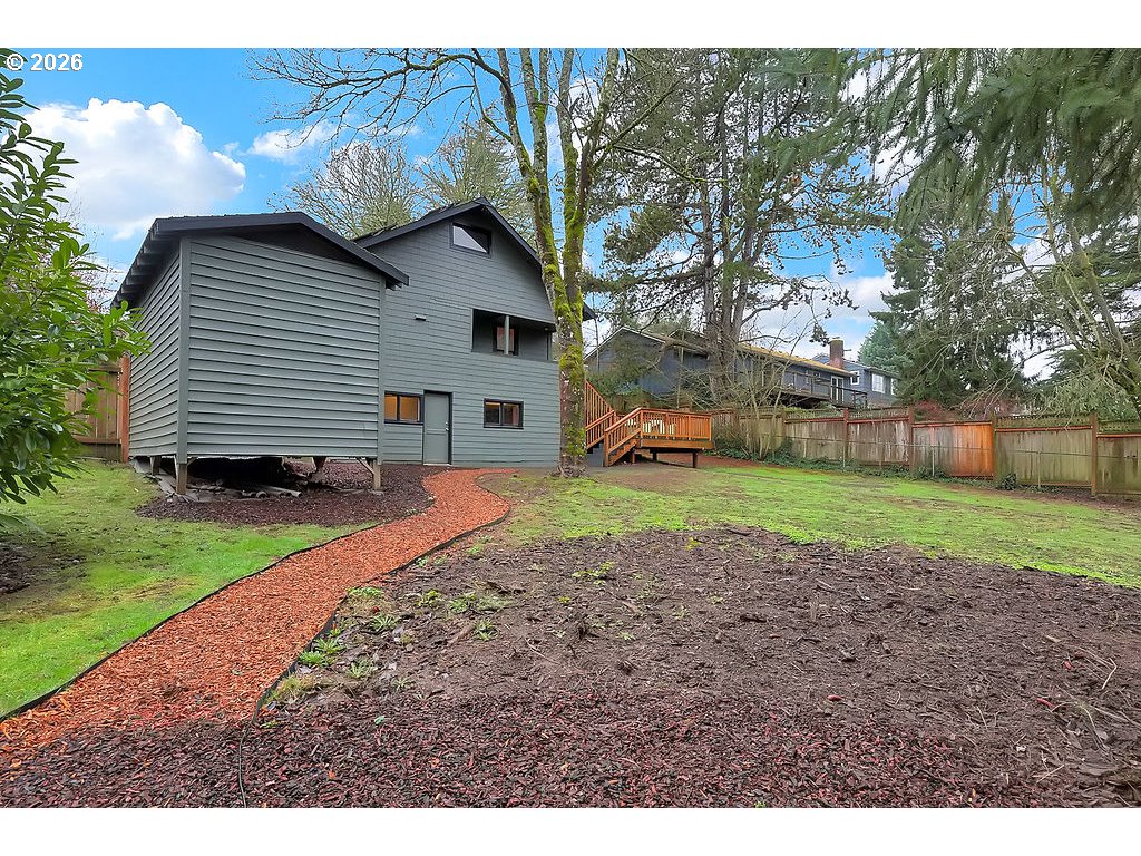 5537 Southwest Florida Street Portland, OR 97219 - Photo 37 of 45 a view of a house with a yard