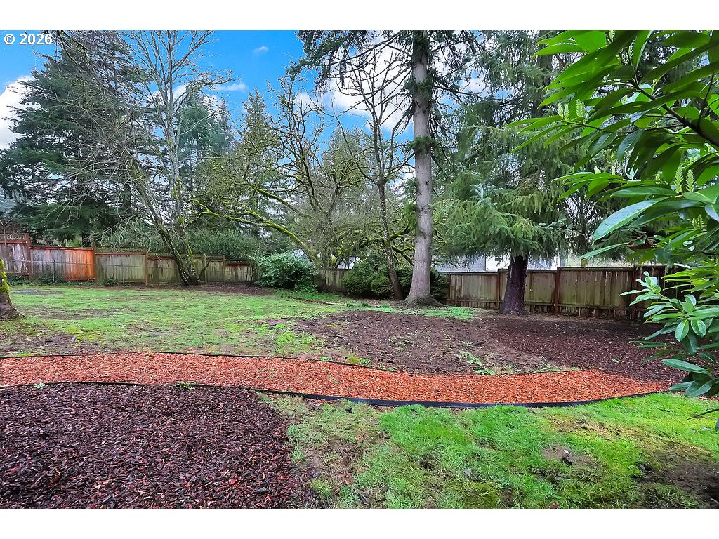 5537 Southwest Florida Street Portland, OR 97219 - Photo 39 of 45 a view of a backyard with green space