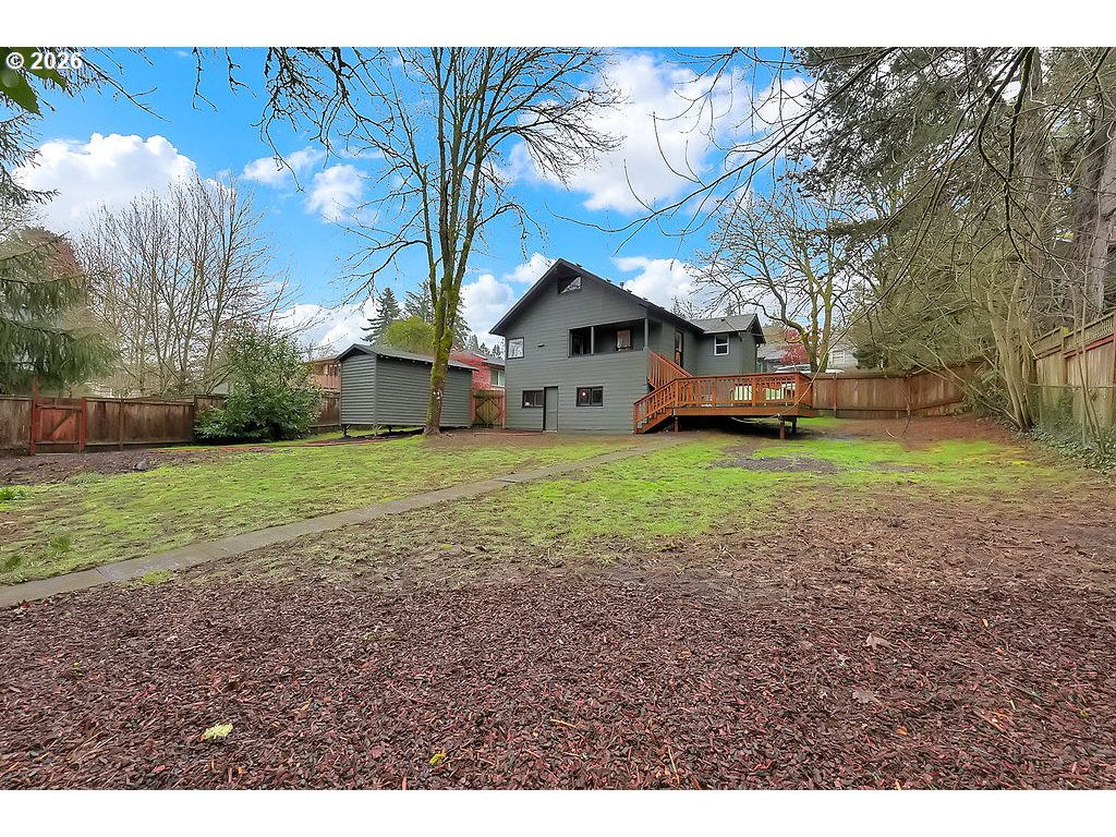 5537 Southwest Florida Street Portland, OR 97219 - Photo 41 of 45 a view of a house with a yard