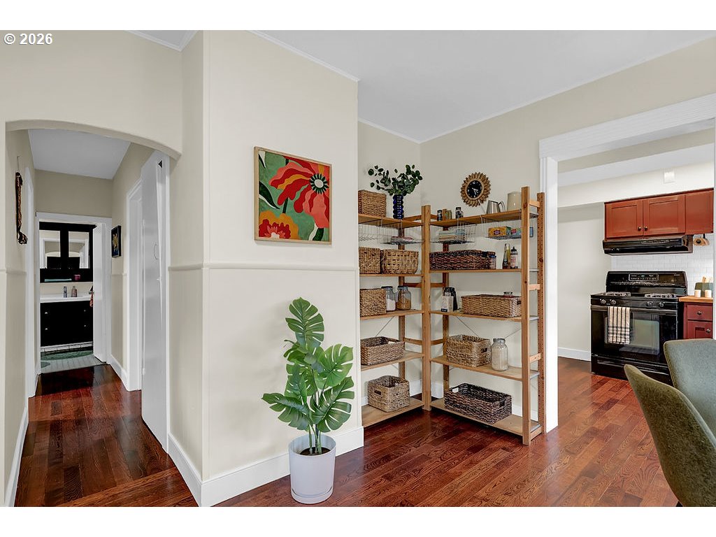 5537 Southwest Florida Street Portland, OR 97219 - Photo 5 of 45 a view of a hallway with wooden floor and furniture