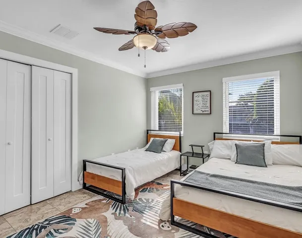 a bedroom with furniture and window