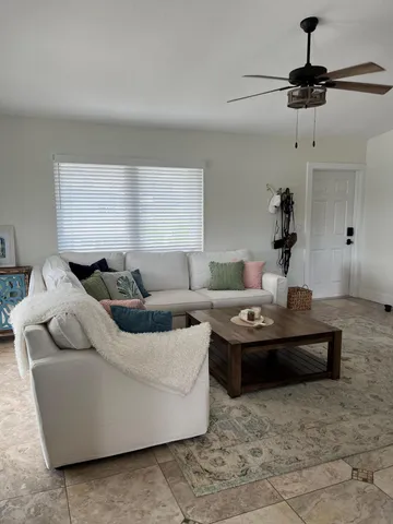 a living room with furniture and a window
