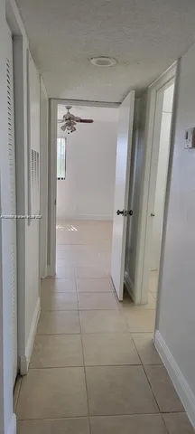 a bathroom with a shower and a glass door