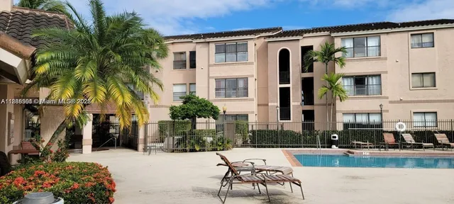 a view of a swimming pool with chairs