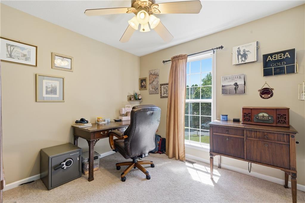 137 Orchard Way Southeast Calhoun, GA 30701 - Photo 13 of 39 a view of a workspace with furniture and a window