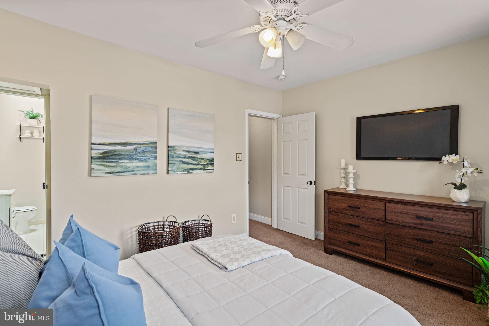 4092 Pechin Street Philadelphia, PA 19128 - Photo 13 of 28 a bedroom with a bed and a flat screen tv