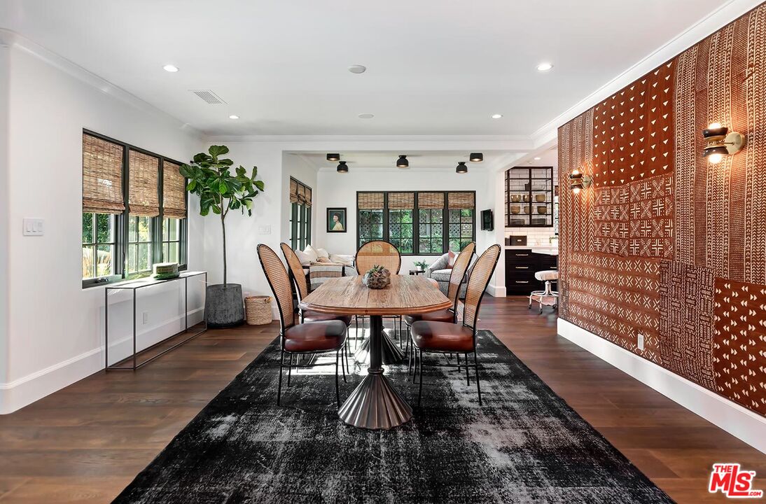 4416 Arcola Avenue Toluca Lake, CA 91602 - Photo 14 of 46 a view of a dining room with furniture window and wooden floor