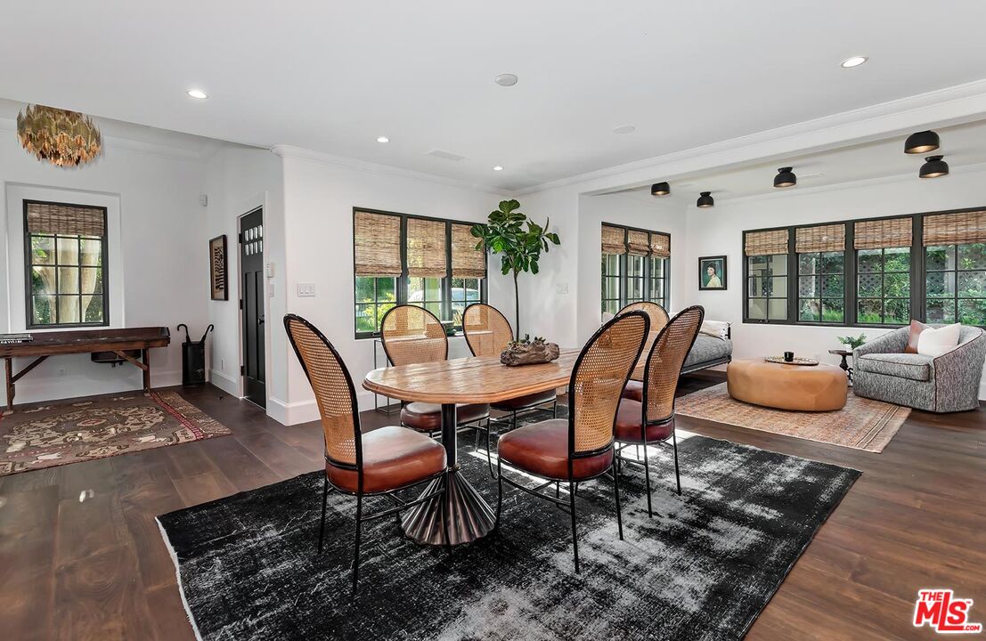 4416 Arcola Avenue Toluca Lake, CA 91602 - Photo 15 of 46 a dining room with furniture and wooden floor