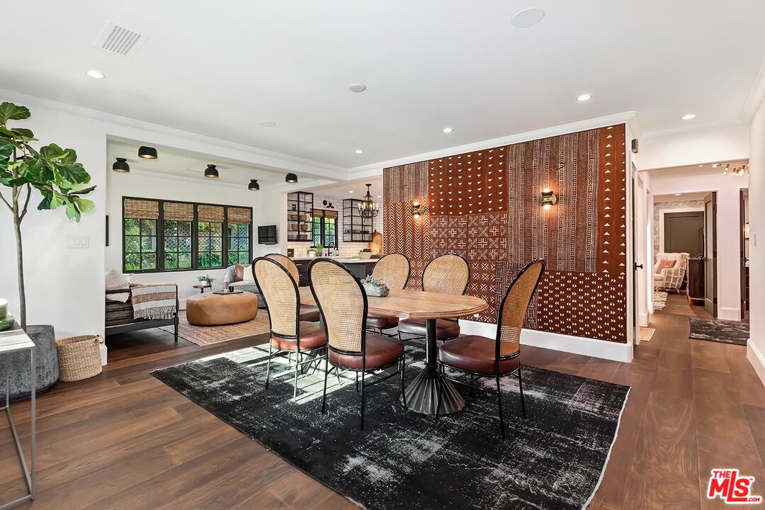 4416 Arcola Avenue Toluca Lake, CA 91602 - Photo 16 of 46 a living room with furniture a rug and a floor to ceiling window