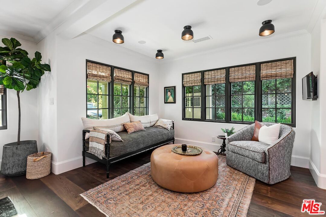 4416 Arcola Avenue Toluca Lake, CA 91602 - Photo 19 of 46 a living room with furniture and a large window
