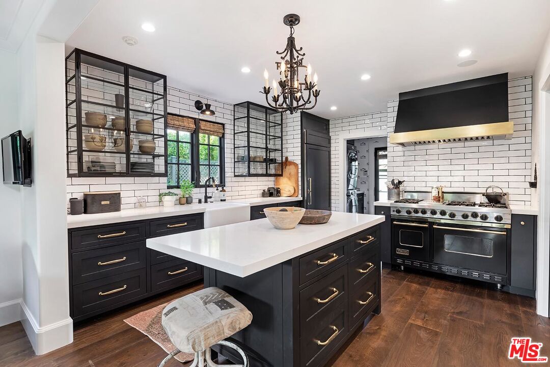 4416 Arcola Avenue Toluca Lake, CA 91602 - Photo 21 of 46 a kitchen with a sink stove and cabinets