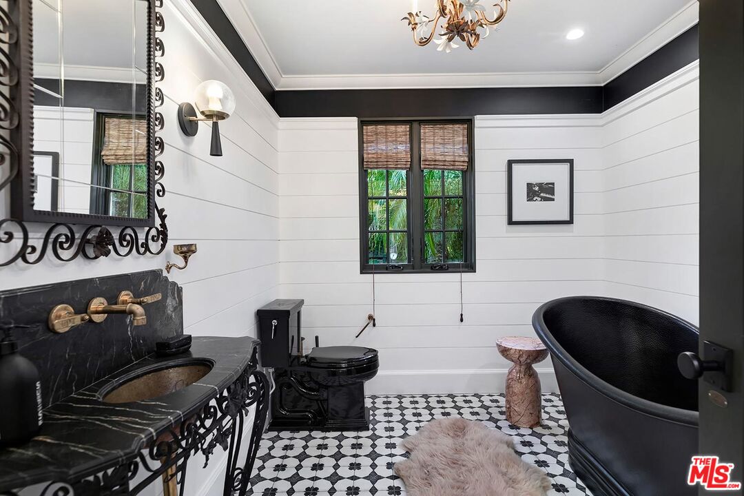 4416 Arcola Avenue Toluca Lake, CA 91602 - Photo 27 of 46 a kitchen with a stove a sink and a microwave